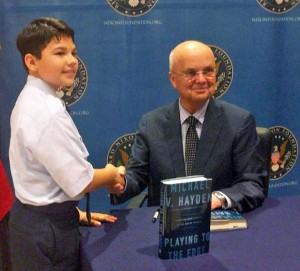 Cadet Logan Griffin receives an autographed copy of the general's book.