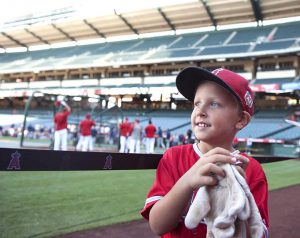Logan Wohlt is all smiles after getting Yunel Escobar's batting gloves during a recent on-field visit to Angel Stadium on Wednesday Sept. 14, 2016. © Photo by Kevin Sullivan, Orange County Register/SCNG