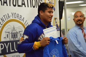 VHS AVID senior proudly displaying 'accepted to college' t-shirt.