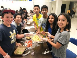 Kraemer Middle School students enjoying Kitchen PRIDE during tutorial.