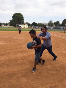 George Key students partaking in a friendly game of kickball.