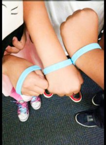 Glenview students showing off their bracelets.