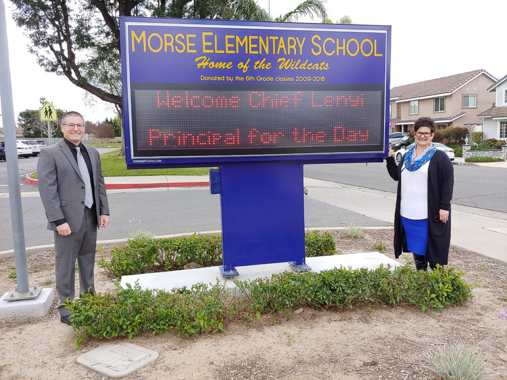 Morse Elementary School's Principal for a Day, Chief Lenyi, and Principal Tonya Gordillo.