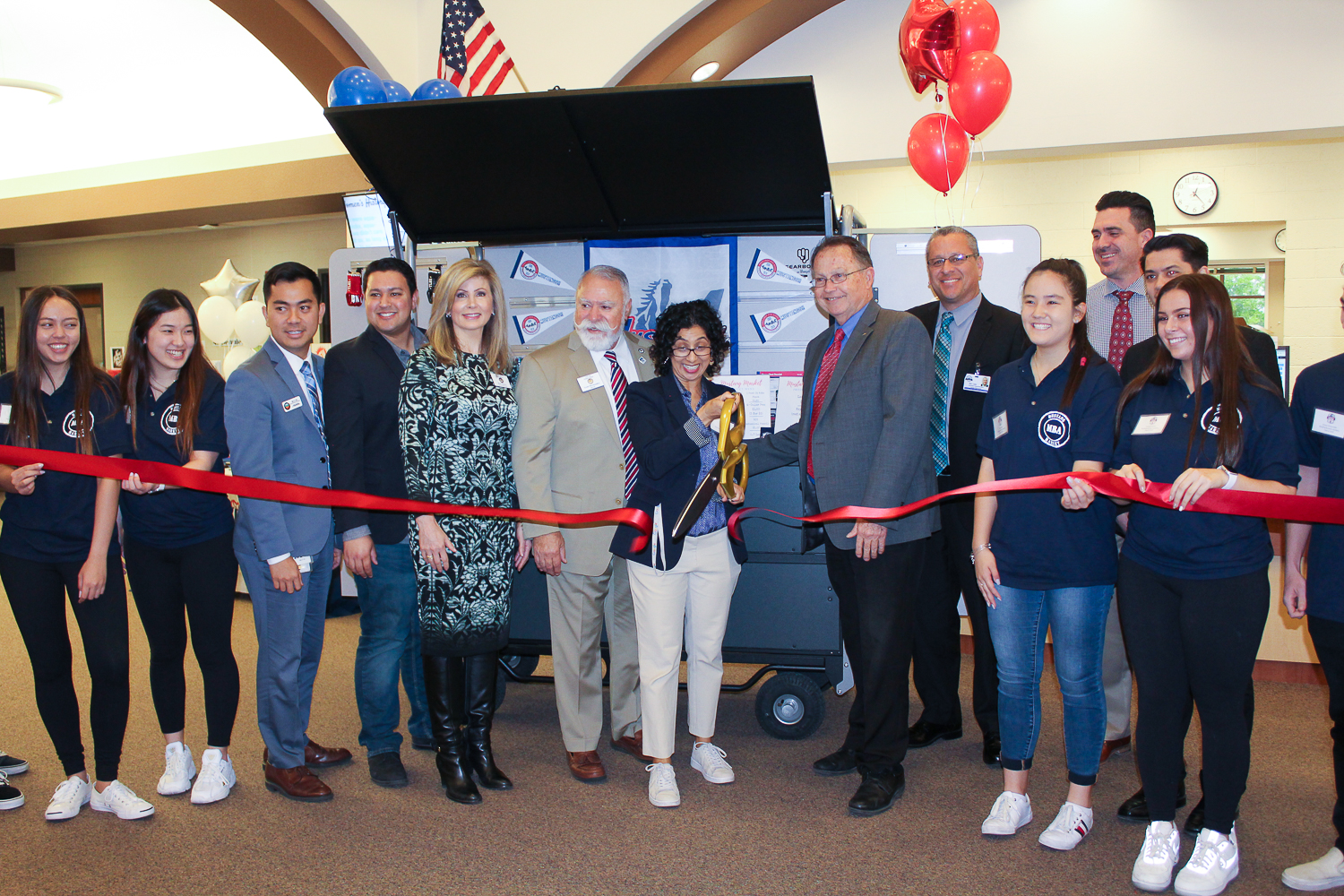 Mustang Market Ribbon Cutting Ceremony featuring students, teachers, administrators, and community representatives.