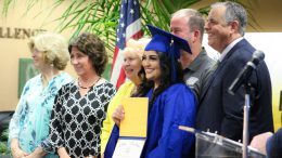 Graduate Johanna Rodriguez from El Camino Real High School proudly holds her newly earning high school diploma with PYLUSD Trustees and Dr. Greg Plutko at the first-ever Summer Graduation Ceremony on August 21, 2019.
