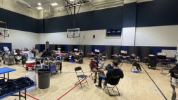 Students donate blood at Red Cross club blood drive.