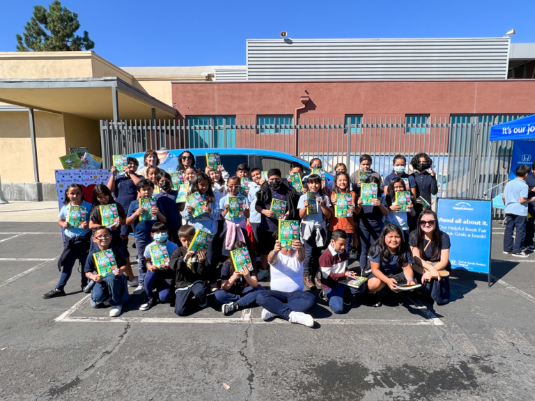 Melrose Elementary School students receive books from Helpful Honda People