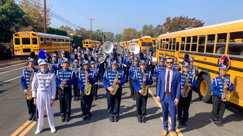 Yorba Linda Middle School band standing in front of buses.