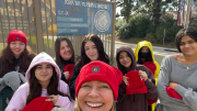 Buena Vista students with teacher Amy DeFriese wearing their new beanies courtesy of Adobe.
