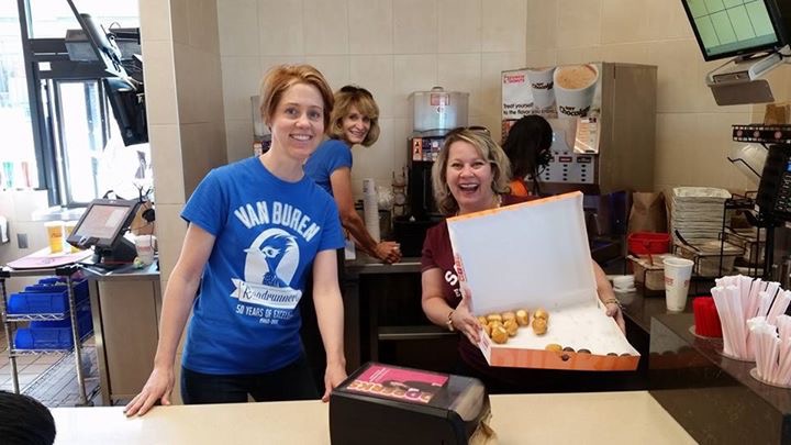Van Buren Elementary teachers serving donuts to students.