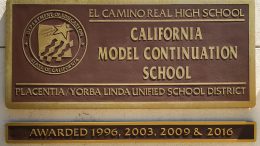 El Camino Real High plaque on the front of the high school.