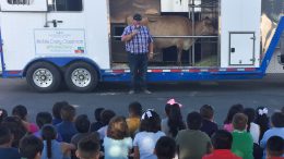 Ruby Drive Elementary students learn from a dairy farmer and observe a real cow.