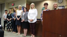 Representative's from Golden Elementary School stand as they're being recognized for earning the title of 2018 National Blue Ribbon School.