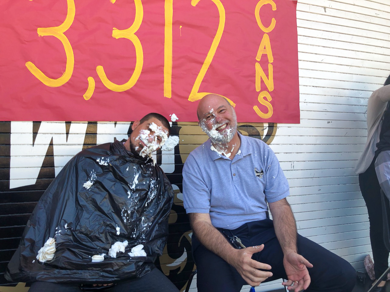 Assistant Principal Dupont (left) and Principal Joey Davis (right) agreed to be pied if their student body raised over 1,000 canned food items for National Honor Society's recent drive.