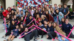Yorba Linda High students and assistant principal, Dr. Richard Dinh, celebrate the school's 10-year anniversary.