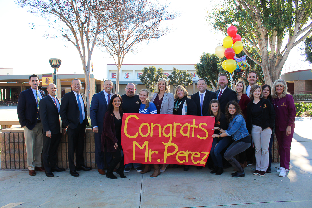 District administrators and Esperanza Aztecs gather to help celebrate teacher Frank Perez as he is identified as a PYLUSD Employee of the Year on Friday, February 8, 2019.