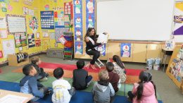 The former Miss Yorba Linda, Rayna Patel, reading to young Lakeview students.