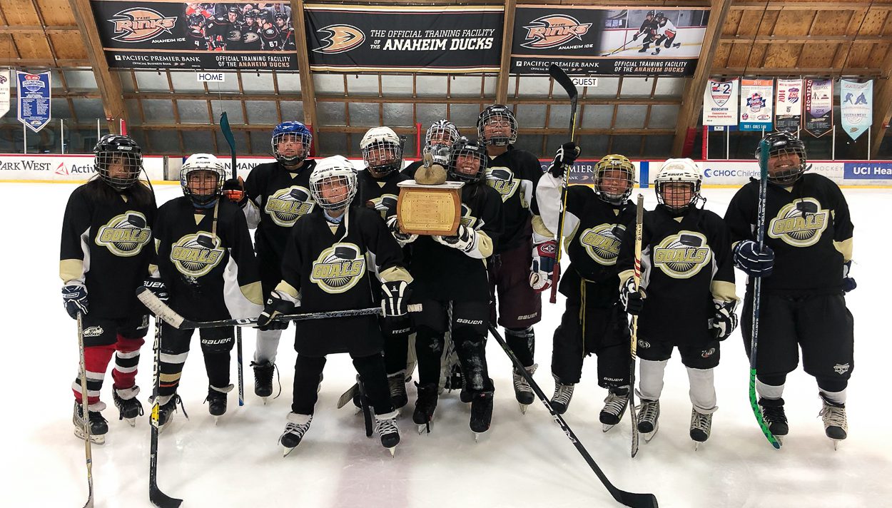 Melrose hockey champions holding their trophy.