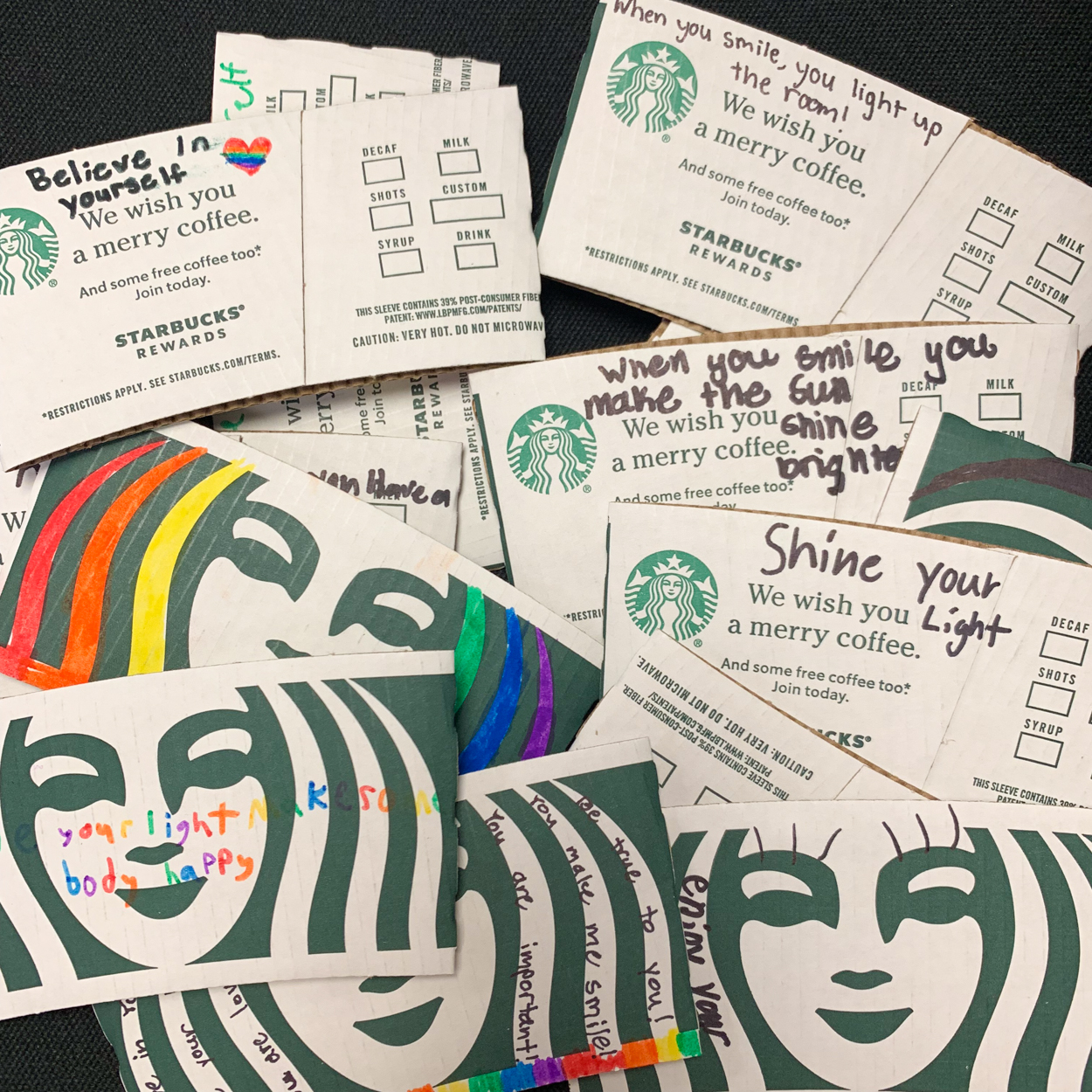 Starbucks sleeves decorated by students.